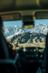 Experience breathtaking snow-capped mountains and rocky landscapes from your RV rental. A stunning scenic travel view.