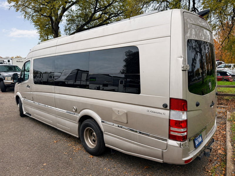 Tan Mercedes Sprinter rv rental campervan, a CS Adventurous XL, with tinted windows & a 'BATMAN' plate. Ideal for adventure! — photo 7