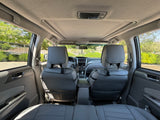 Inside view of a comfortable vehicle, ideal as a support car for your rv rental trips. Gray seats & sunroof.