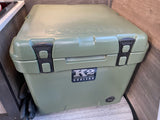 An olive green K2 Summit 30 cooler, ideal for an RV rental, sits ready for camping trips.