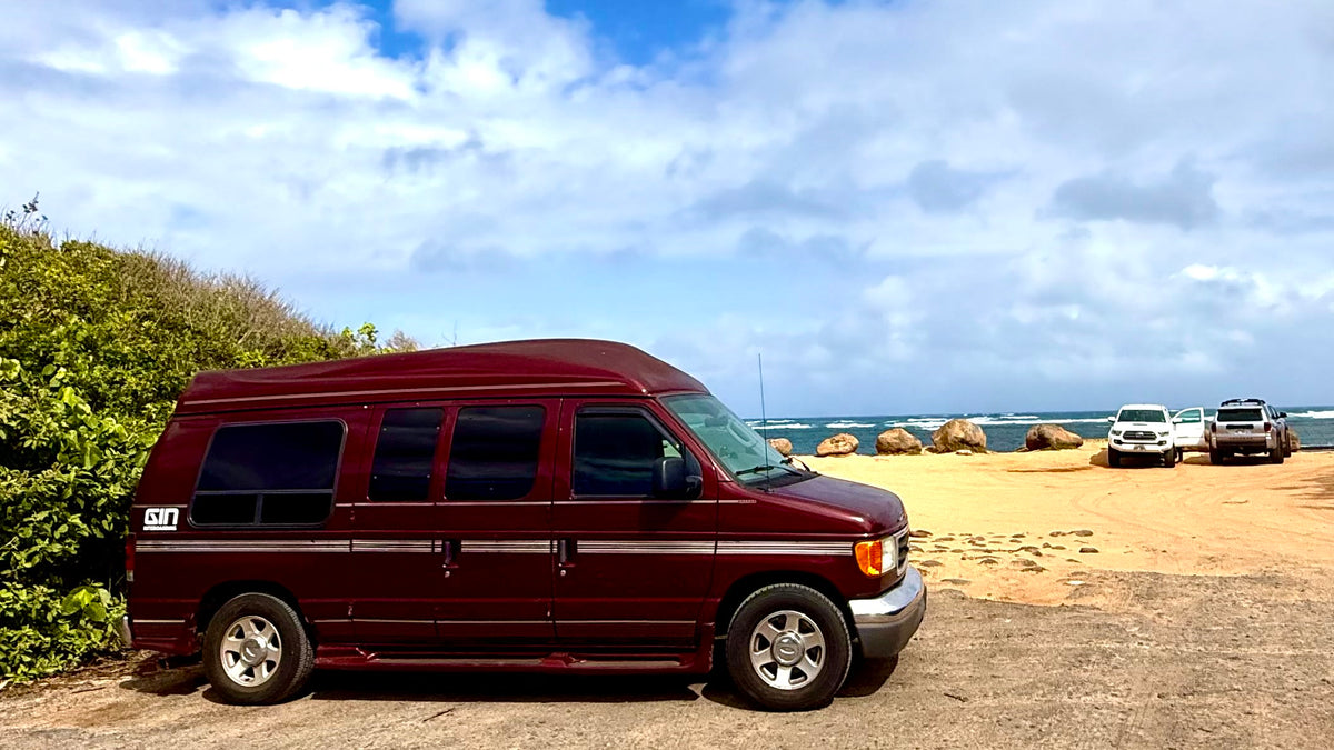  and trees. Dirt ground. #rvrental|Explore this practical RV rental setup: a comfy elevated bed — photo 8