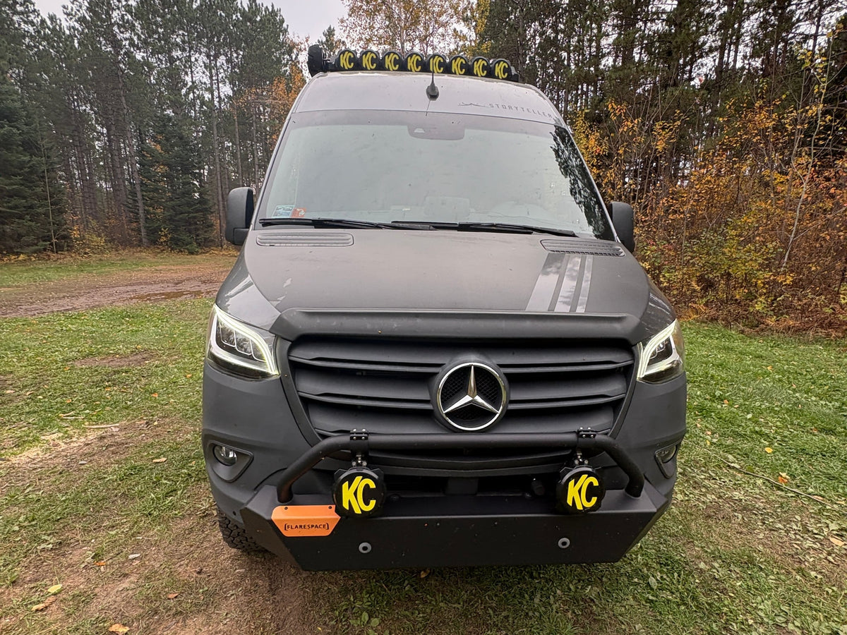  an ideal RV rental with off-road lights & custom bumper for wilderness trips.|This gray Mercedes Sprinter adventure van — photo 7