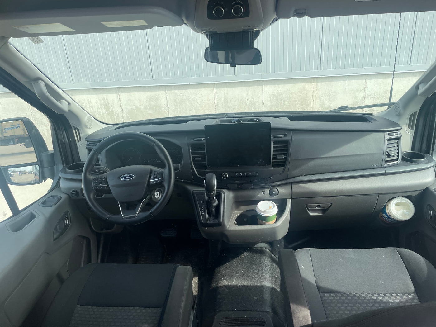  parked in a lot.|Custom dark gray Vandoit camper van — photo 10
