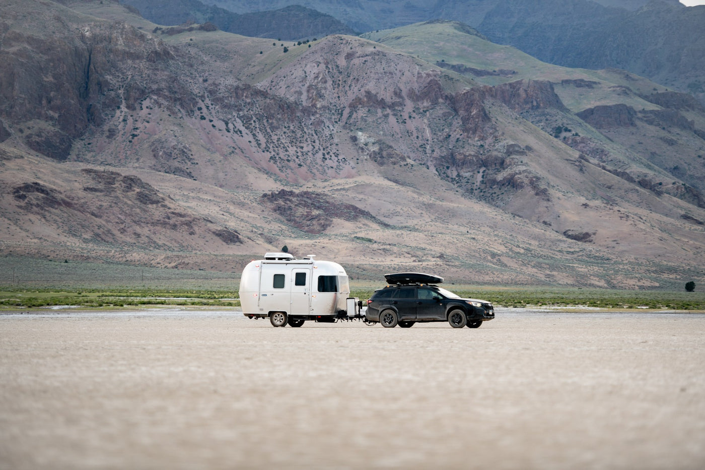  and dinette area visible for comfortable living.|Modern RV rental interior with a bright dinette setup — photo 4
