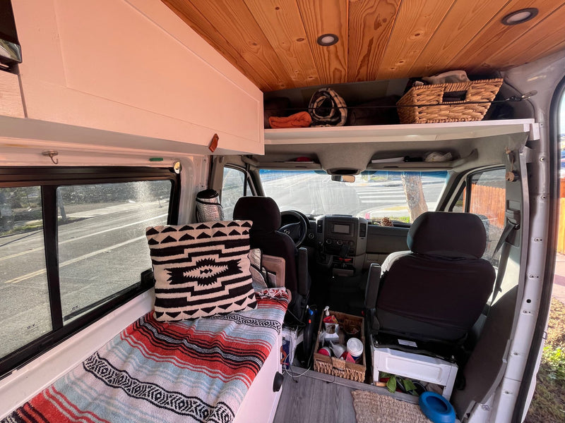  and bed area. Perfect for mobile living.|Step into this charming RV rental! Features a compact kitchen — photo 7