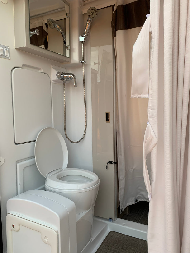  optimized for efficient travel living.|Inside an **rv rental**: A modern kitchen — photo 7
