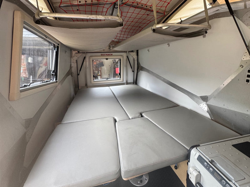  ready for winter camping adventures.|Inside a compact RV rental: a pop-up camper with AC — photo 4