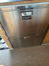 Stainless steel RV rental fridge/freezer drawers showing 39°F. Modern appliance for your mobile kitchen.
