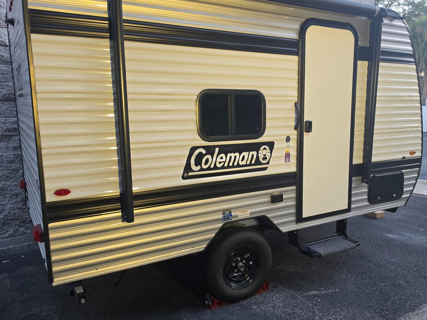  and a cozy bed with pillows. Ready for adventure.|RV rental kitchen cabinet with stacked bowls — photo 12