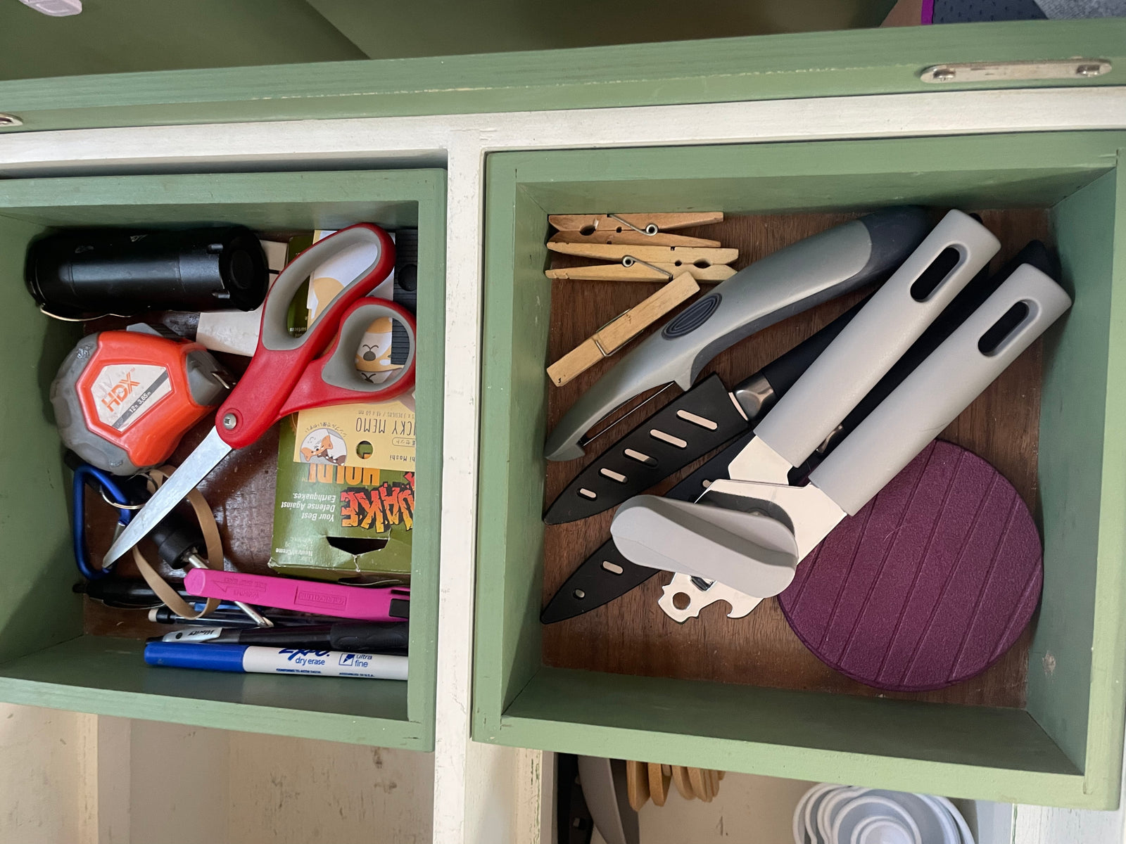 Inside an **RV rental**, compact, organized cubbies hold utility tools like scissors & knives, plus kitchen gadgets and sticky notes.