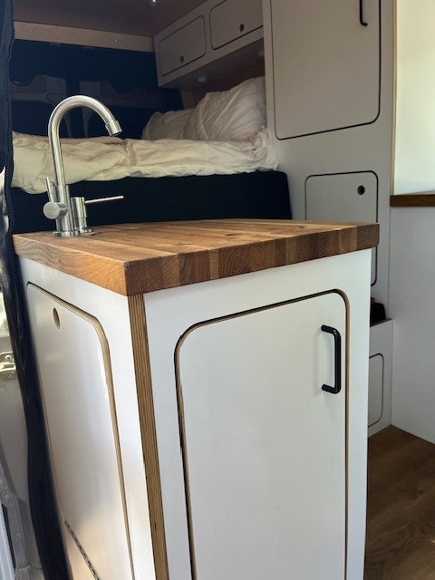  and rear utility setup.|This customized silver Sprinter van with a rooftop tent is ready for your next RV rental adventure.|Custom silver Sprinter van — photo 2