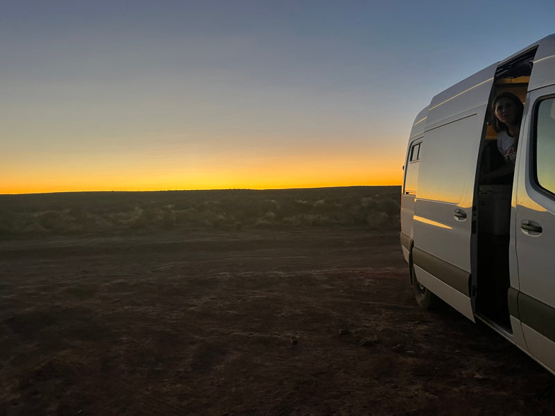  and natural wood accents. Perfect for travel.|Experience comfort in this RV rental. Bright camper van interior with a modern kitchen — photo 6