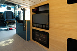 RV rental interior: EcoFlow power system, flexible table, and fire extinguisher within a modern van conversion.