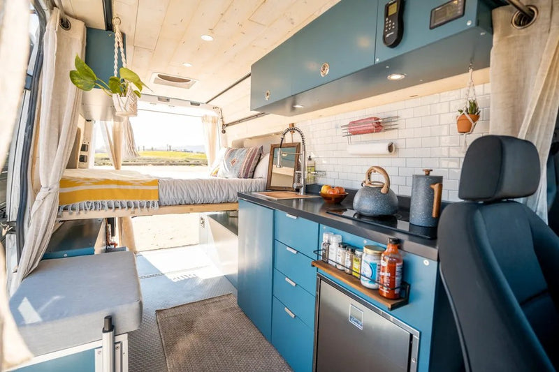 Modern rv rental van conversion features a compact kitchen — photo 1
