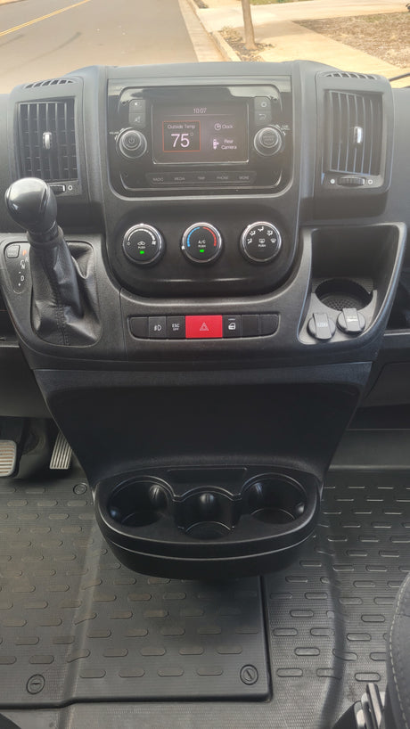 View inside an **RV rental** showing the dashboard with a 75° temperature display, gear shift, and USB ports.