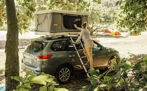 Gray AWD Nissan Pathfinder with Rooftop Tent