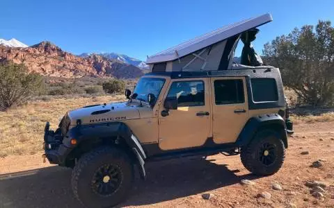 Jeep Rubicon w/pop up camper and all camping gear 