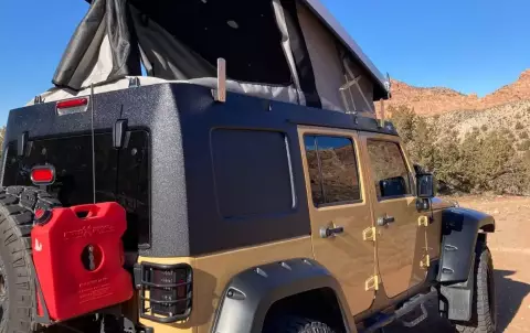 Jeep Rubicon w/pop up camper and all camping gear 